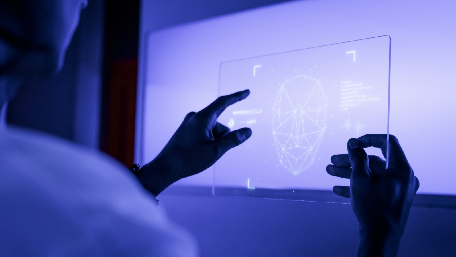 designer-using-transparent-digital-tablet-screen-futuristic-technology