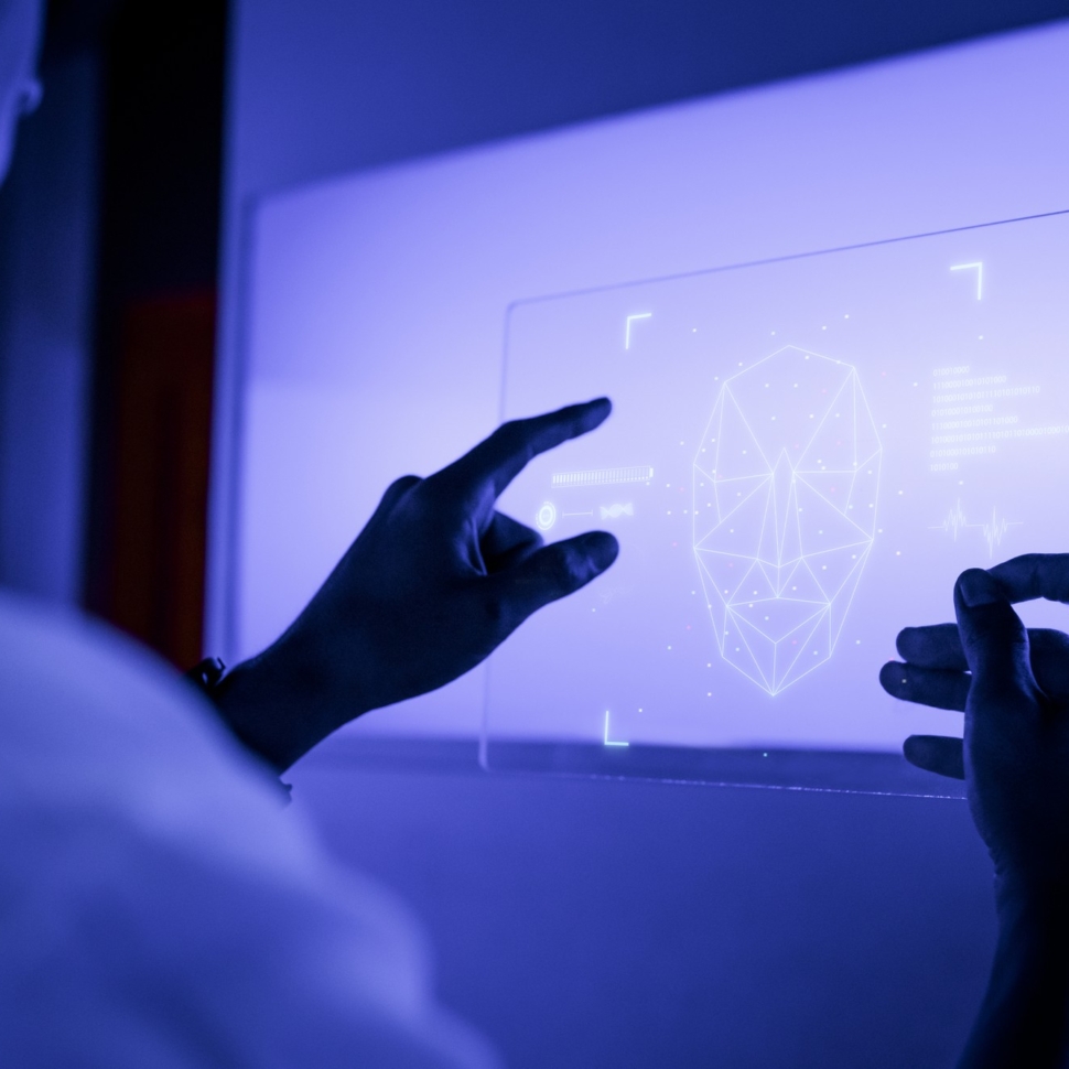 designer-using-transparent-digital-tablet-screen-futuristic-technology